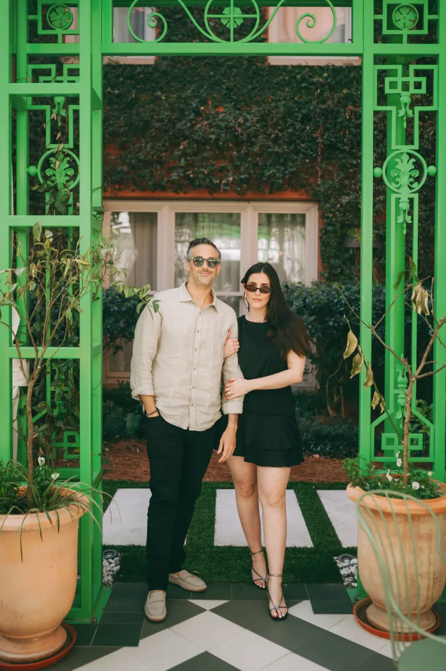 Scott Levy and Emilie Sobel, co-founders of Driftprint, standing in front of a green storefront